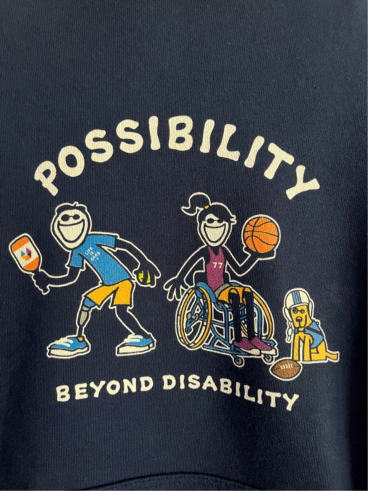 Close-up of navy Possibility Beyond Disability hoodie design