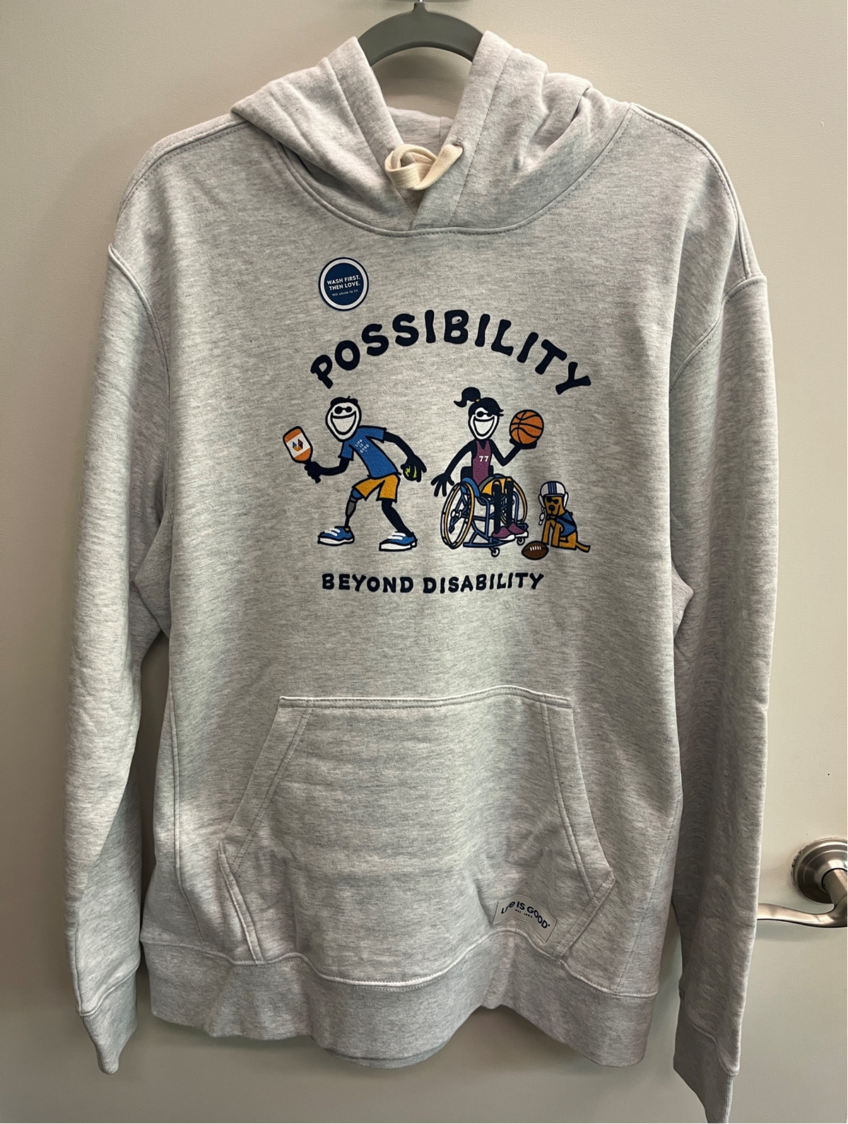 Front of light gray Possibility Beyond Disability hoodie